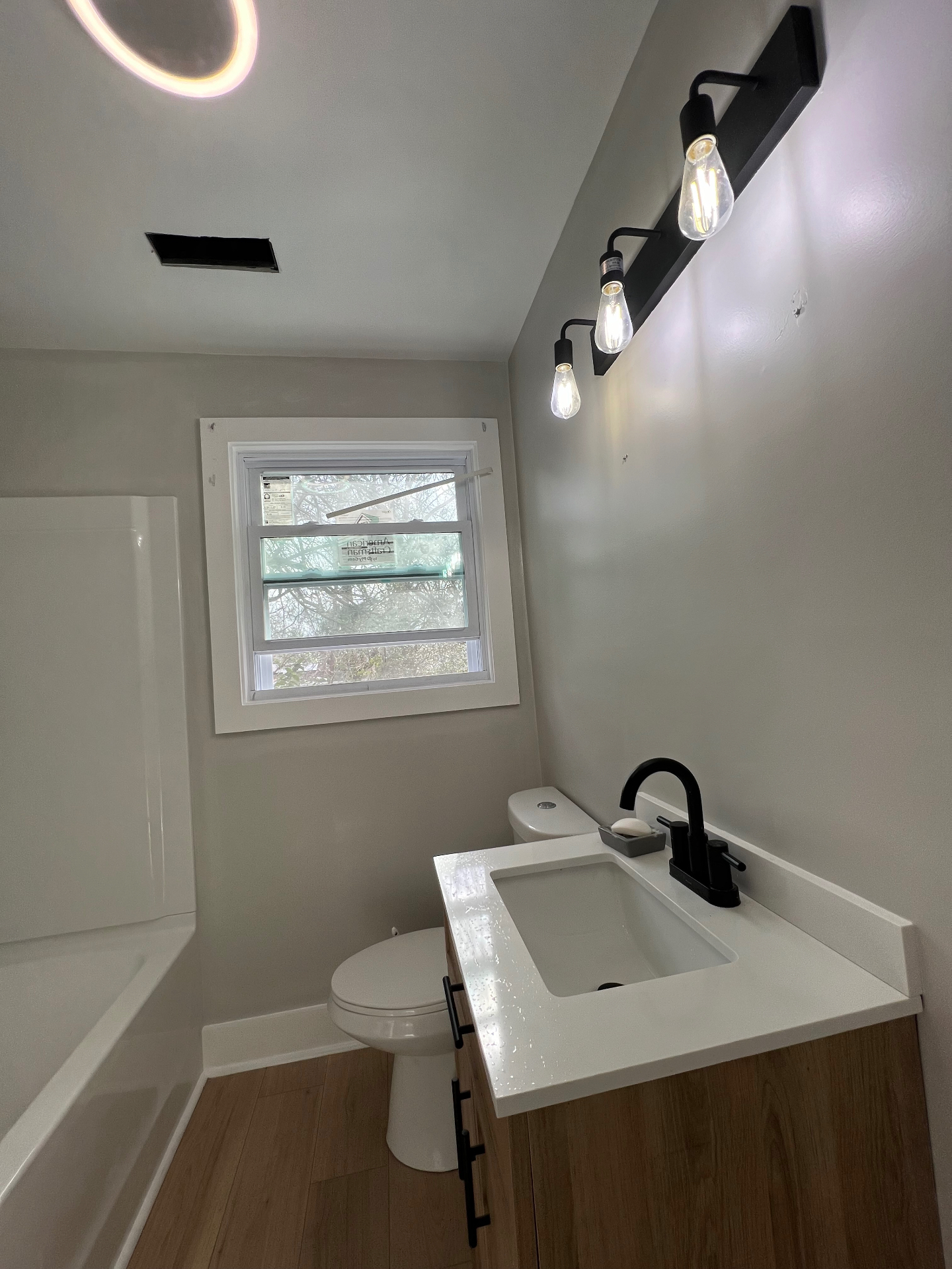 Bathroom finish with custom vanity and lighting
